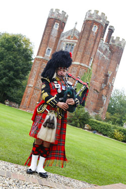 Roy playing the bagpipes at an event